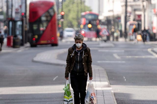 A lone shopper walks down central London’s Oxford Street in April