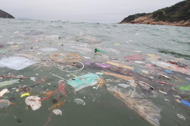 Medical masks float amid debris in waters near Hong Kong
