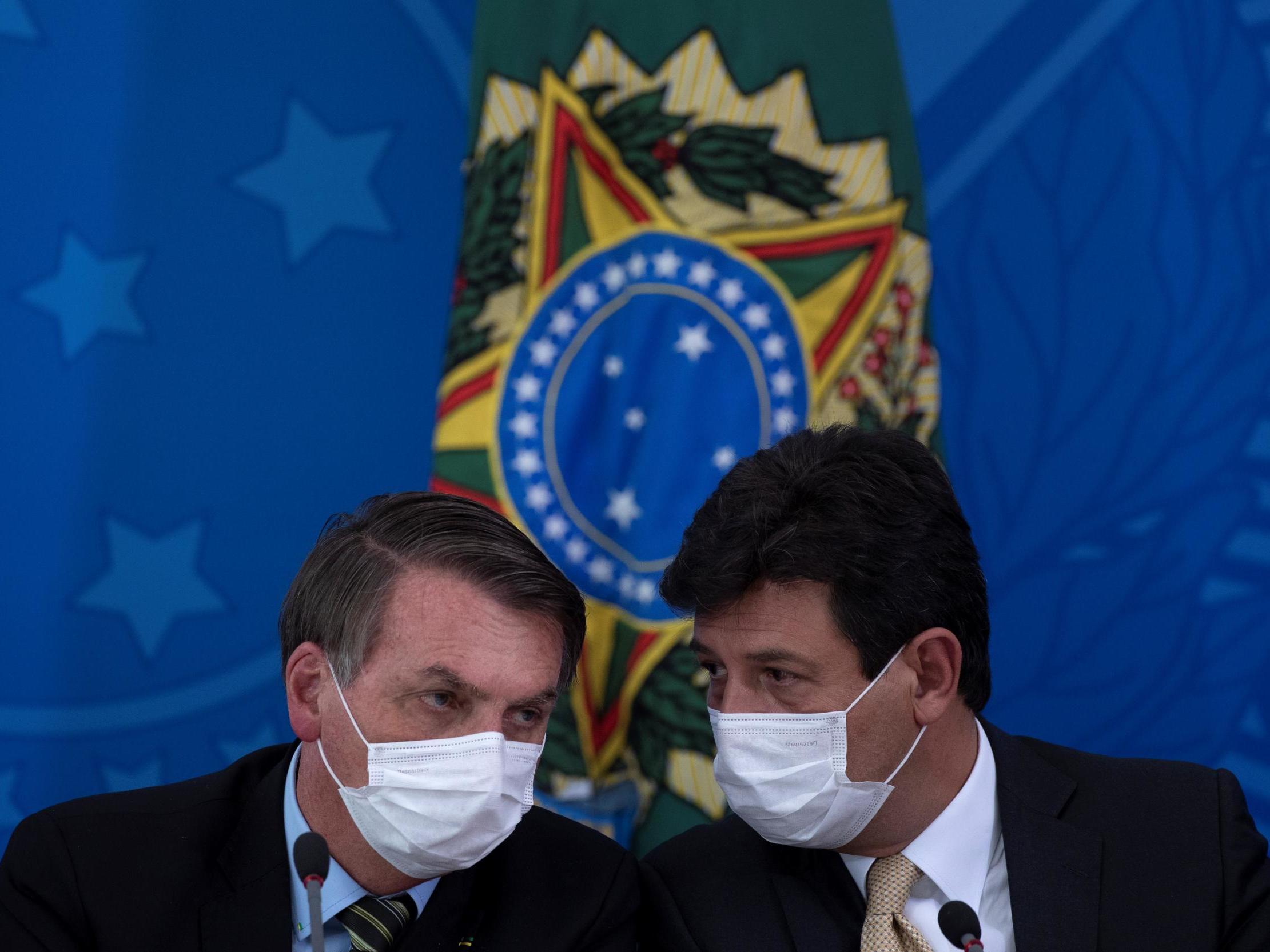 President of Brazil Jair Bolsonaro and then Minister of Health Luiz Henrique Mandetta attend a press conference on the measures taken by the government against the spread of the coronavirus