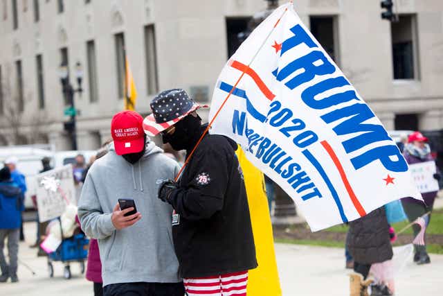'Operation Gridlock' protesters wear Trump hats and carry Trump flags.