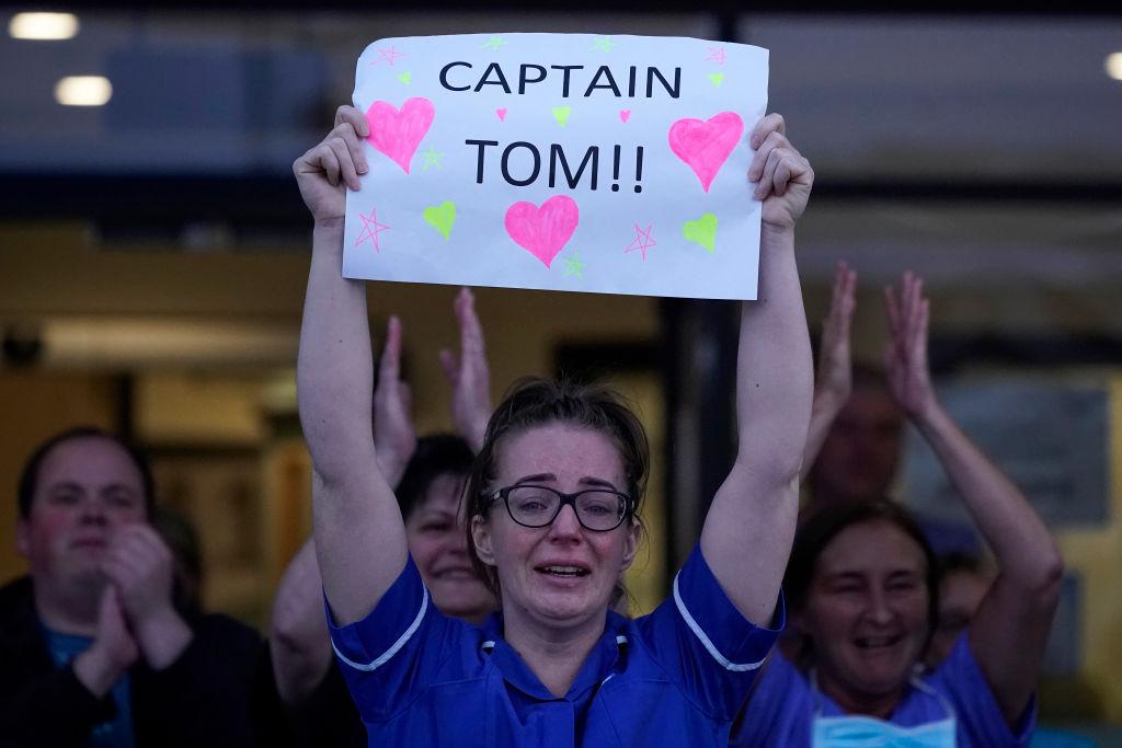 A nurse at Aintree University Hospital sheds a tear and as she pays tribute to super fundraiser Captain Tom Moore