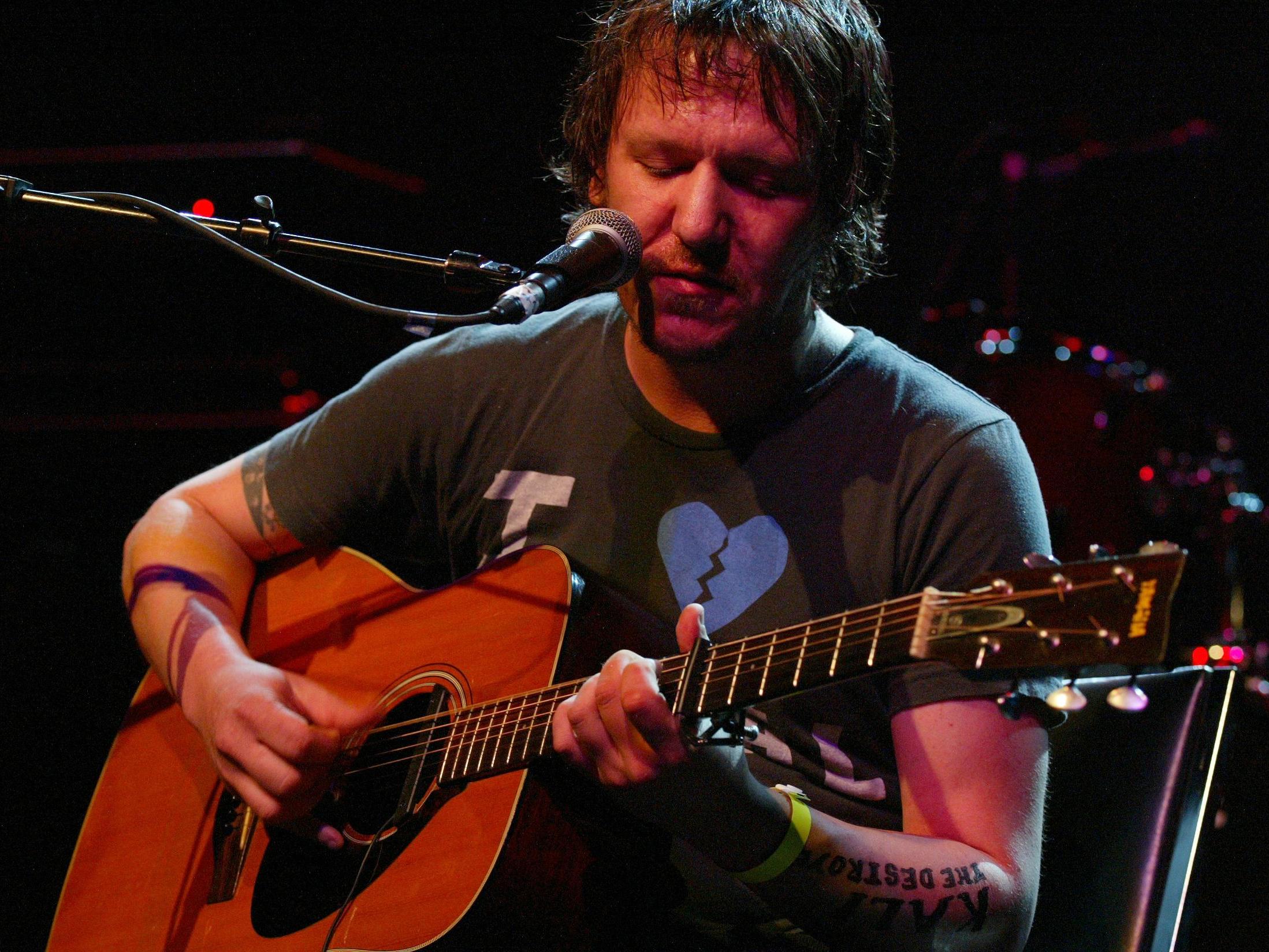 Singer-songwriter Elliott Smith performing on stage at the LA Weekly Music Awards show