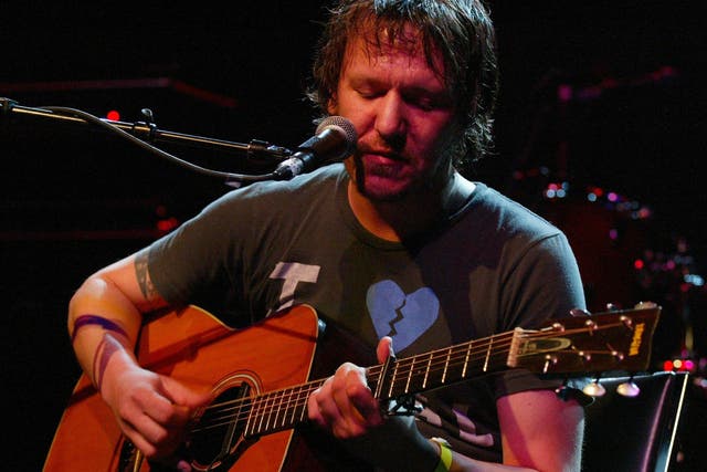 Singer-songwriter Elliott Smith performing on stage at the LA Weekly Music Awards show