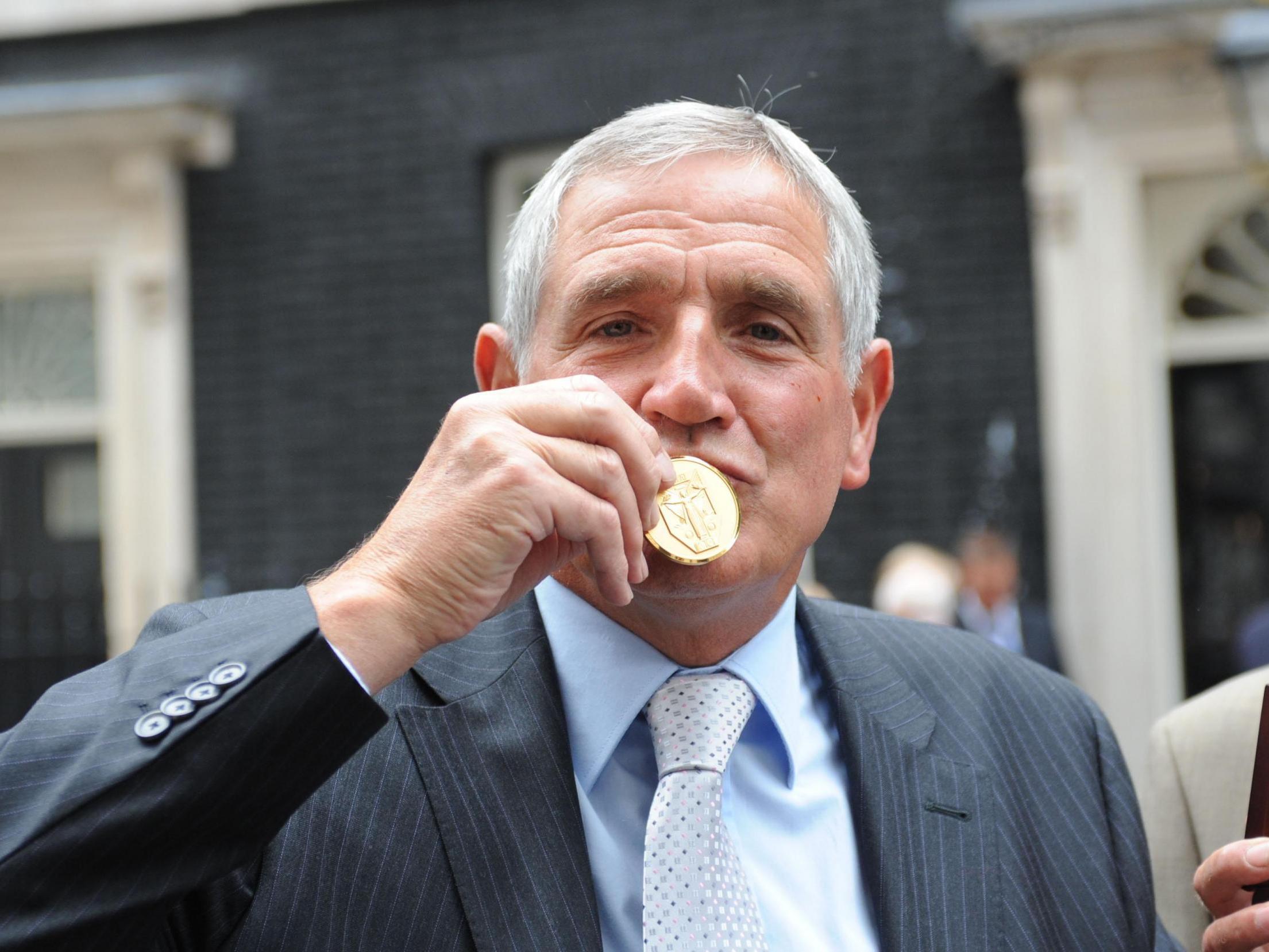 Norman Hunter receives a gold medal from Prime Minister Gordon Brown for being part of England's 1966 World Cup-winning squad, 2009