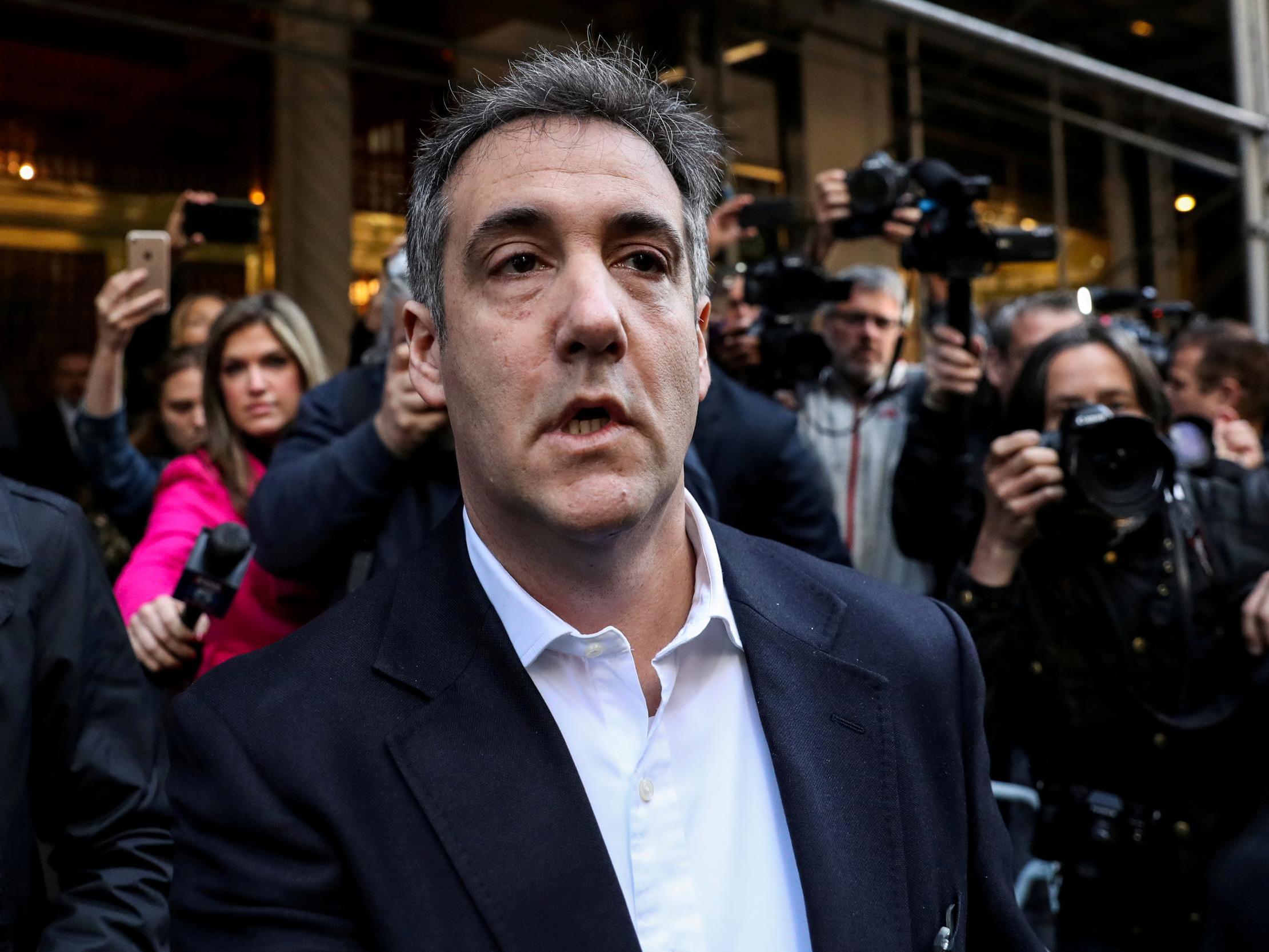 Michael Cohen leaving his apartment to report to prison
