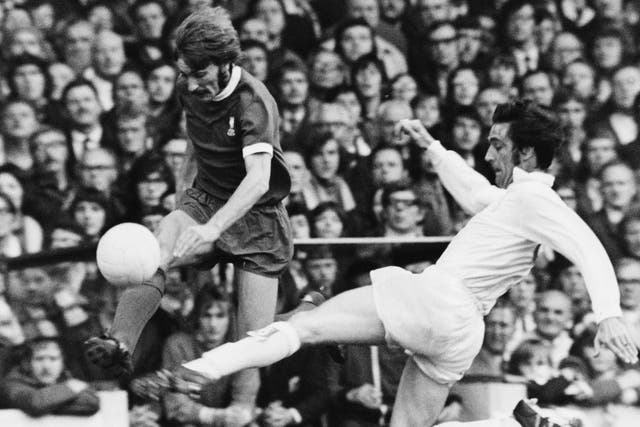 Norman Hunter (R) sliding to tackle Liverpool's Steve Heighway