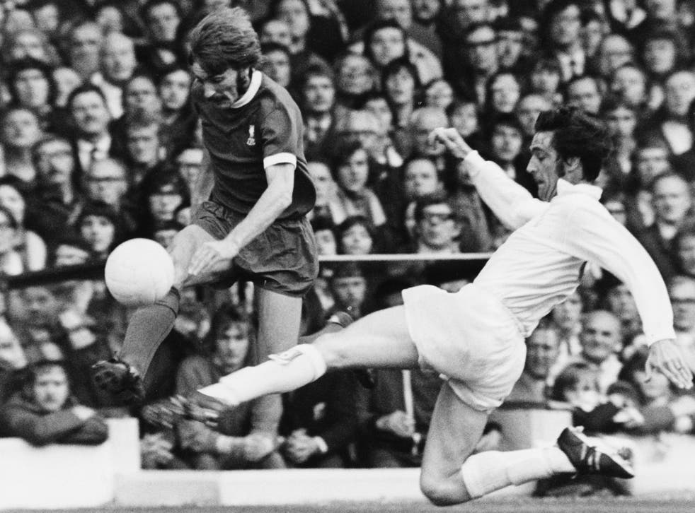 Norman Hunter (R) sliding to tackle Liverpool's Steve Heighway