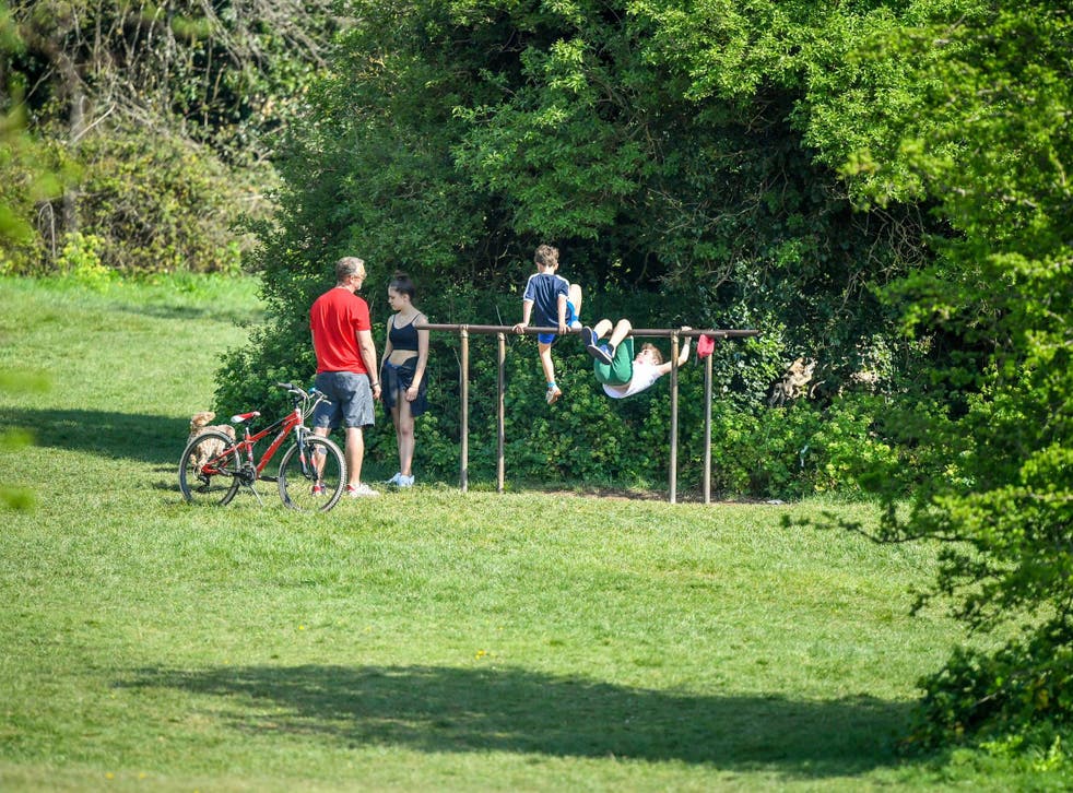 A family exercises in the bank holiday sunshine on Clifton Down, Bristol, in their outdoor time during the UK COVID-19