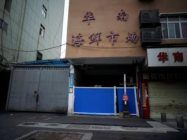 A blocked entrance to Wuhan's Huanan market, where the coronavirus that can cause Covid-19 is believed to have first surfaced
