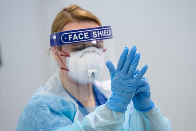 A member of staff receives PPE training at the Nightingale Hospital in Manchester