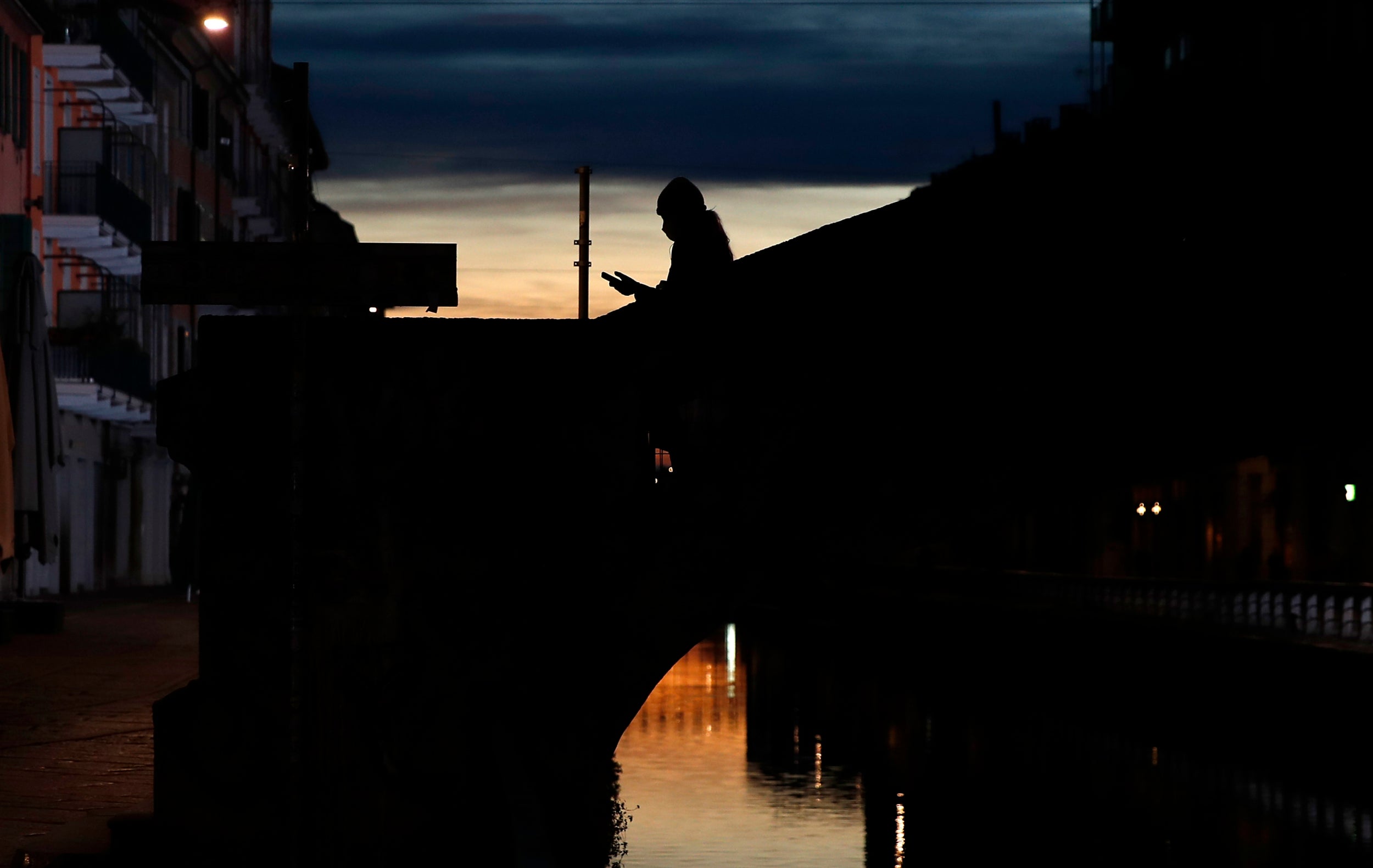 The Naviglio Grande canal in Milan: across Europe governments are using surveillance to curtail the lethal spread of the new coronavirus