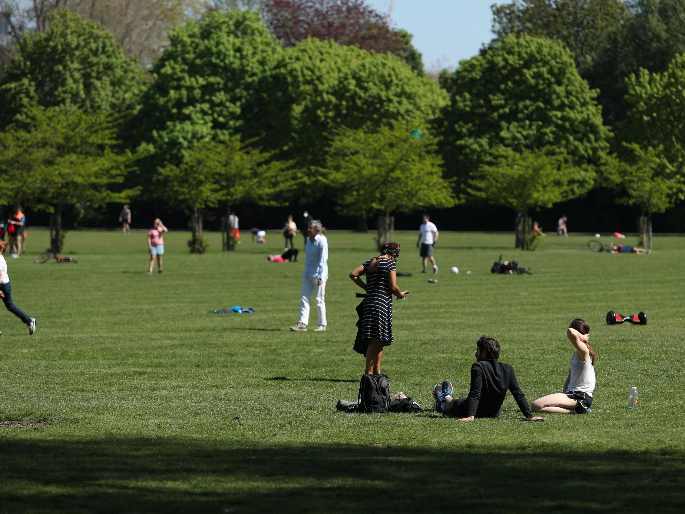 People enjoying the warm weather in Battersea Park, London, as the UK continues in lockdown to help curb the spread of the coronavirus