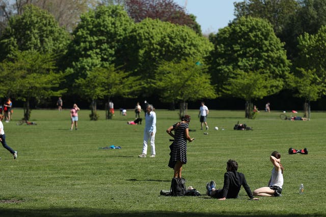 People enjoying the warm weather in Battersea Park, London, as the UK continues in lockdown to help curb the spread of the coronavirus