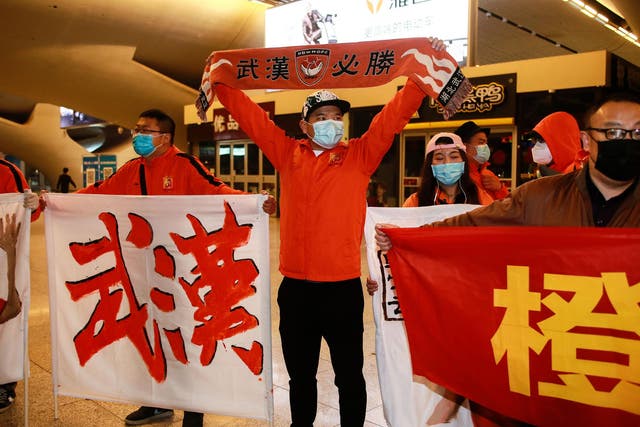 Fans of Wuhan Zall welcome their team home