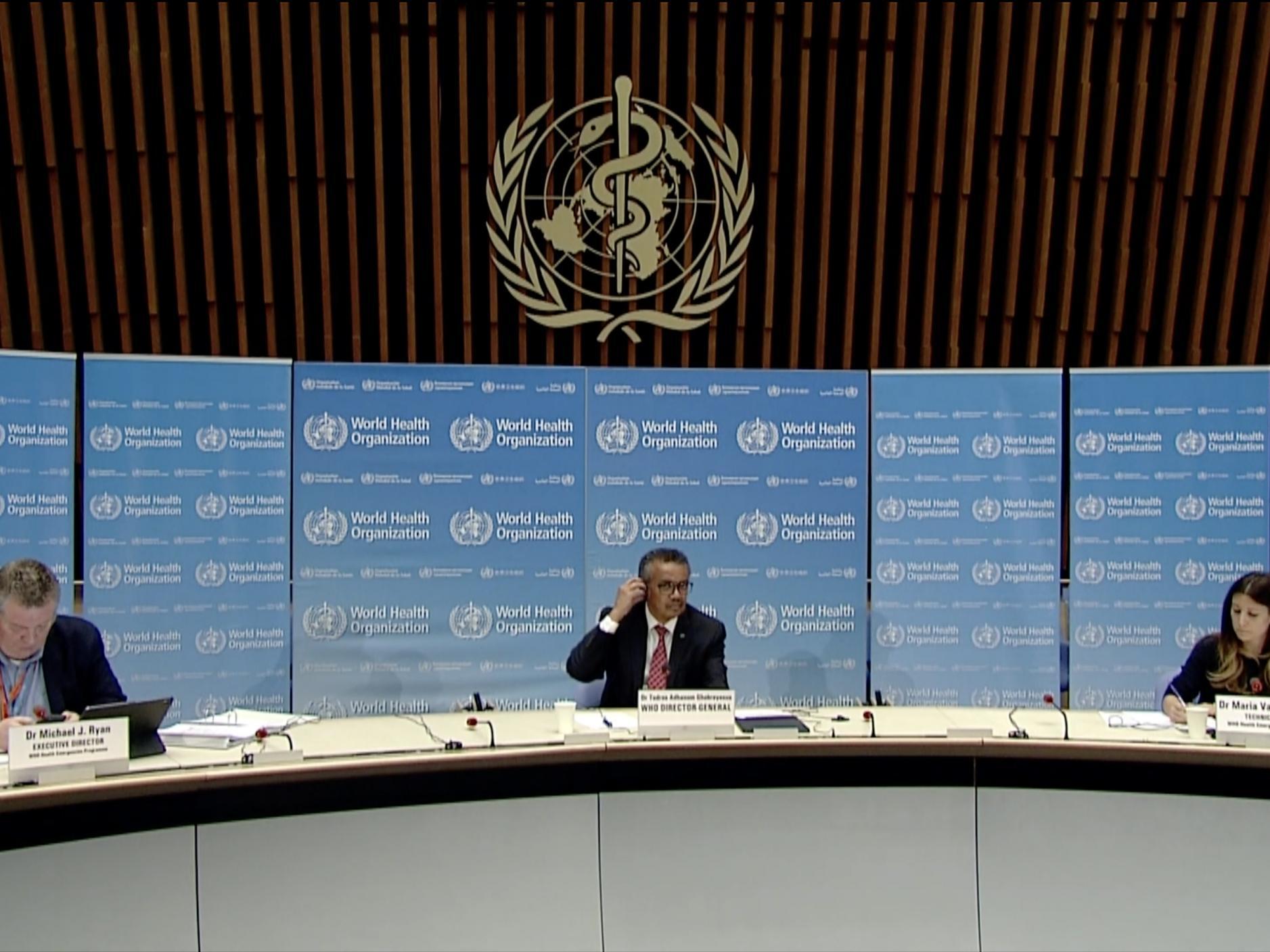A TV grab from the World Health Organization (WHO) website shows (From L) World Health Organization (WHO) Health Emergencies Programme Director Michael Ryan, WHO Director-General Tedros Adhanom Ghebreyesus and WHO Technical Lead Maria Van Kerkhove attending a WHO virtual news briefing on the COVID-19 from the WHO headquarters, on 17 April 2020 in Geneva