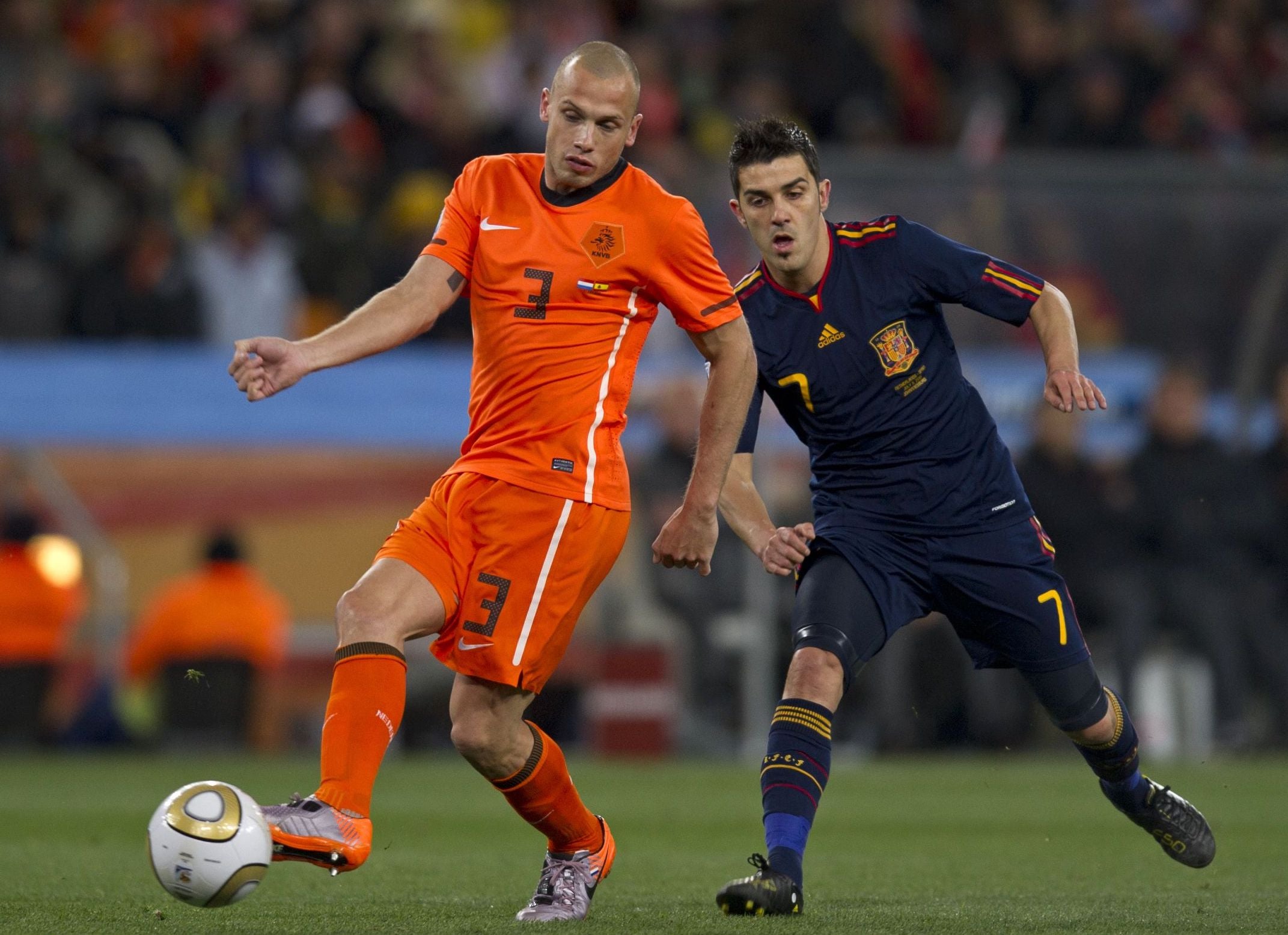 John Heitinga of Netherlands and David Villa of Spain at the 2010 Fifa World Cup Final