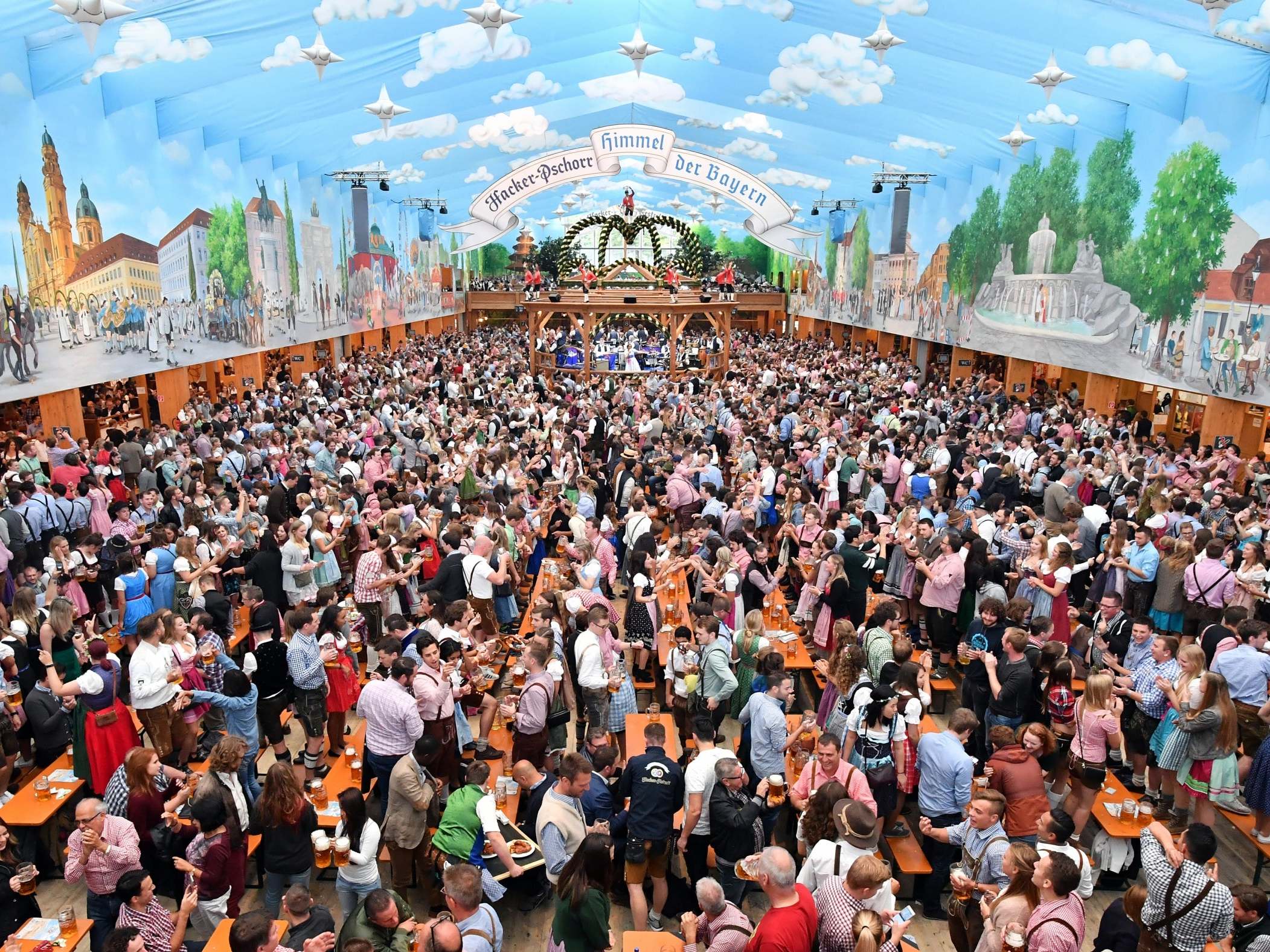 Visitors celebrate in the beer tent 'Hacker-Pschorr - Himmel der Bayern' ('Bavarian heaven') at day 2 of the 2017 Oktoberfest beer festival