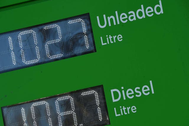 The price in GBP of unleaded petrol and diesel fuel is displayed outside an ASDA petrol station in Glasgow