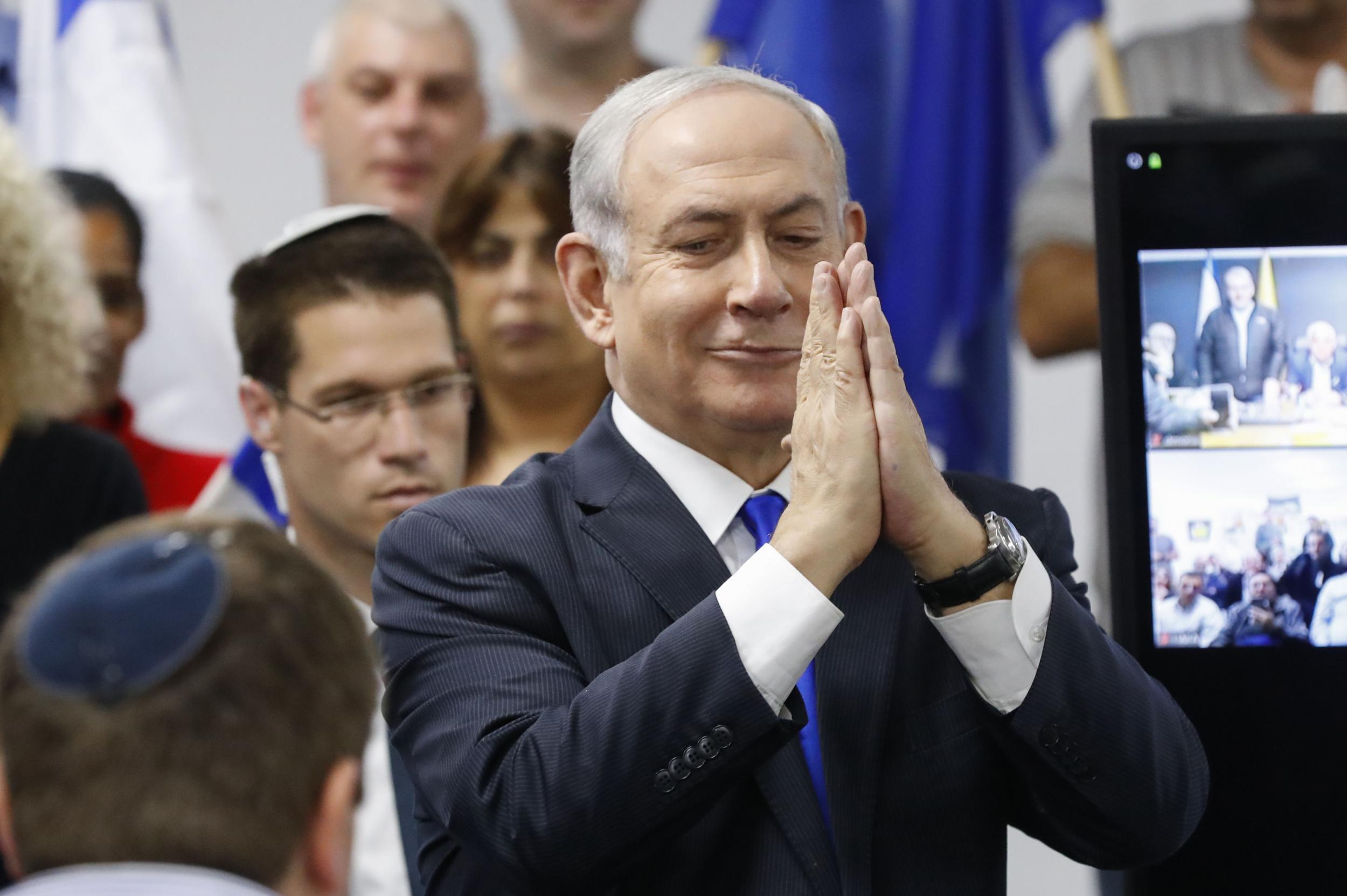 Israel's Prime Minister and leader of the Likud Party Benjamin Netanyahu gestures as he delivers a statement in the Israeli central city of Petah Tikva