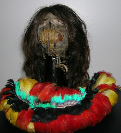 Wheeler’s shrunken head with a feather headdress