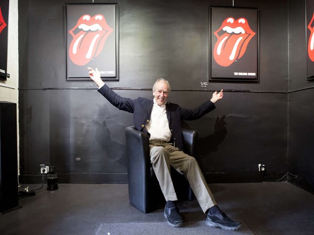Designer John Pasche poses with his famous logo in Paris