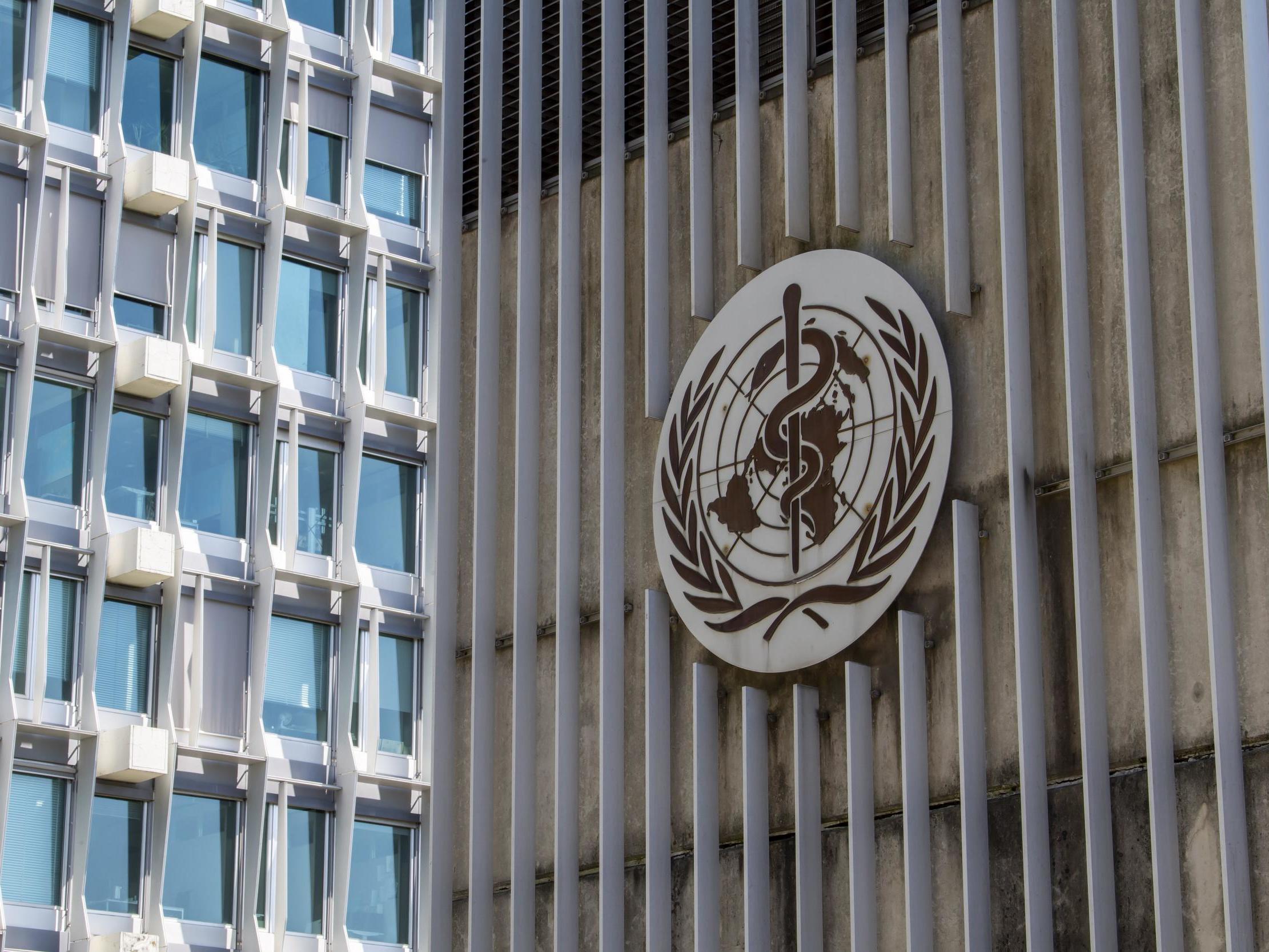 The logo and building of the World Health Organisation headquarters in Geneva, Switzerland