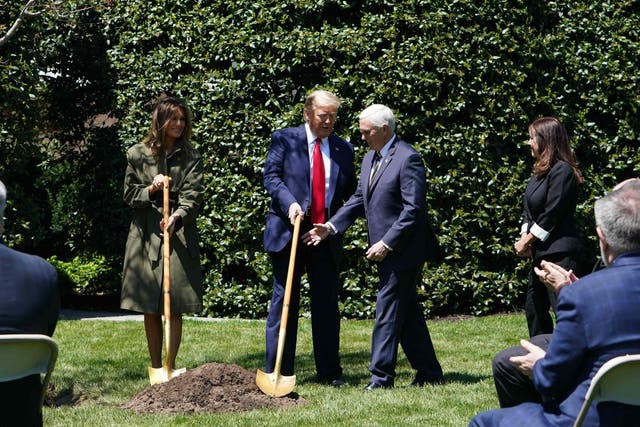 First Lady Melania Trump, President Trump, Vice President Mike Pence and Karen Pence participate in a tree planting ceremony to mark Earth Day and Arbor Day at the White House on 22 April 22, 2020