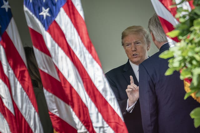 Donald Trump speaks to House Minority Leader Kevin McCarthy after a tree planting at the White House in recognition of Earth Day and Arbor Day