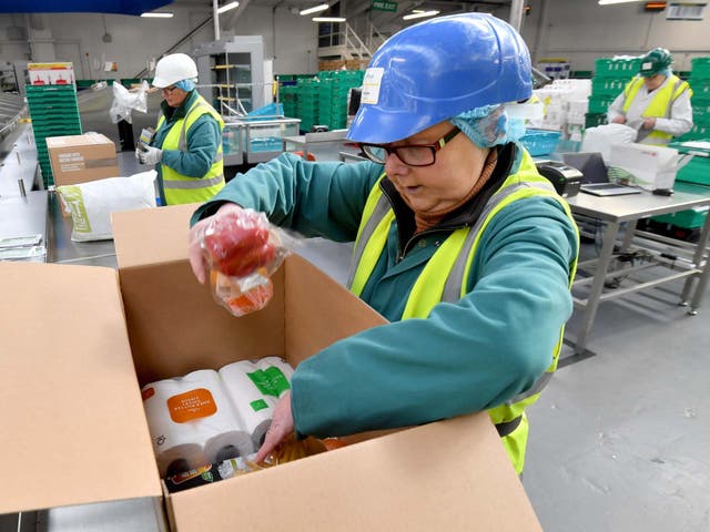 Staff pack delivery boxes at Morrisons food packaging plant in Bradford, 9 April 2020.
