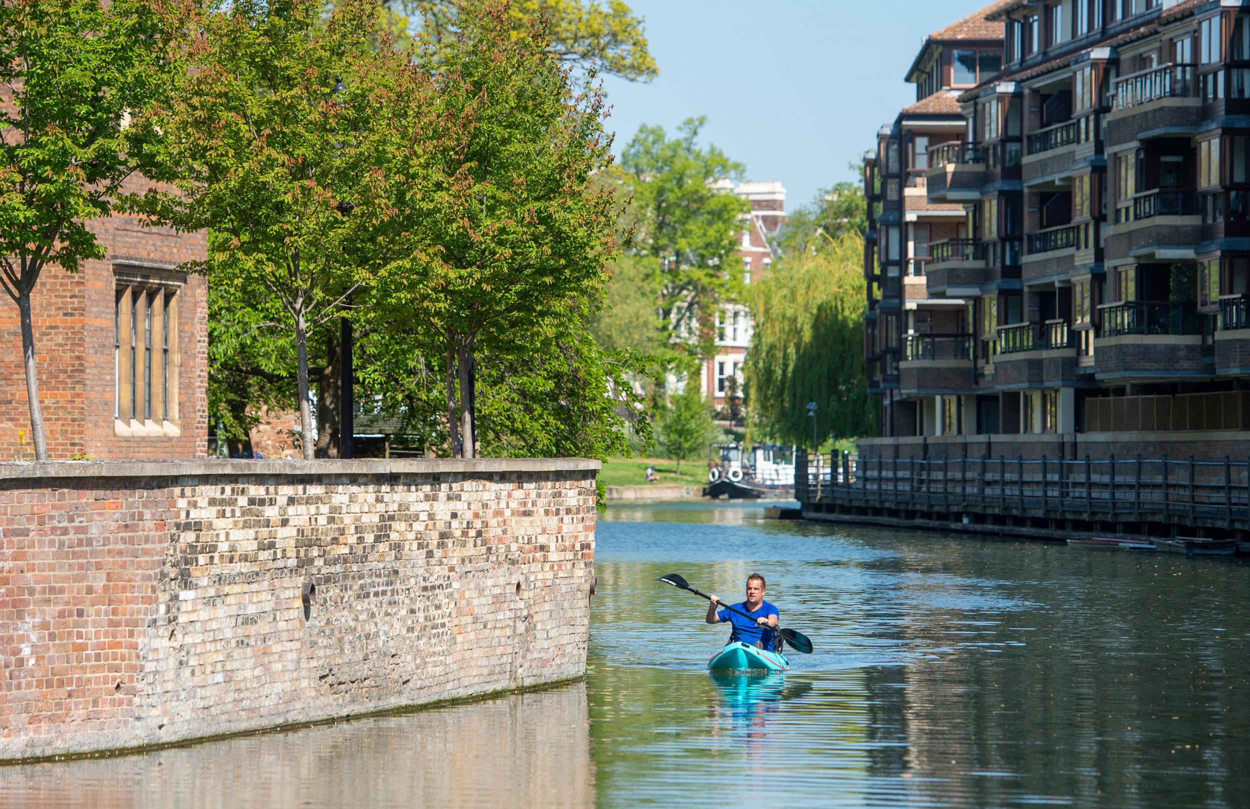 A man kayaks along the River Cam in Cambridge, as parts of the UK will enjoy 24C heat over the coming days as the hottest April in six years continues