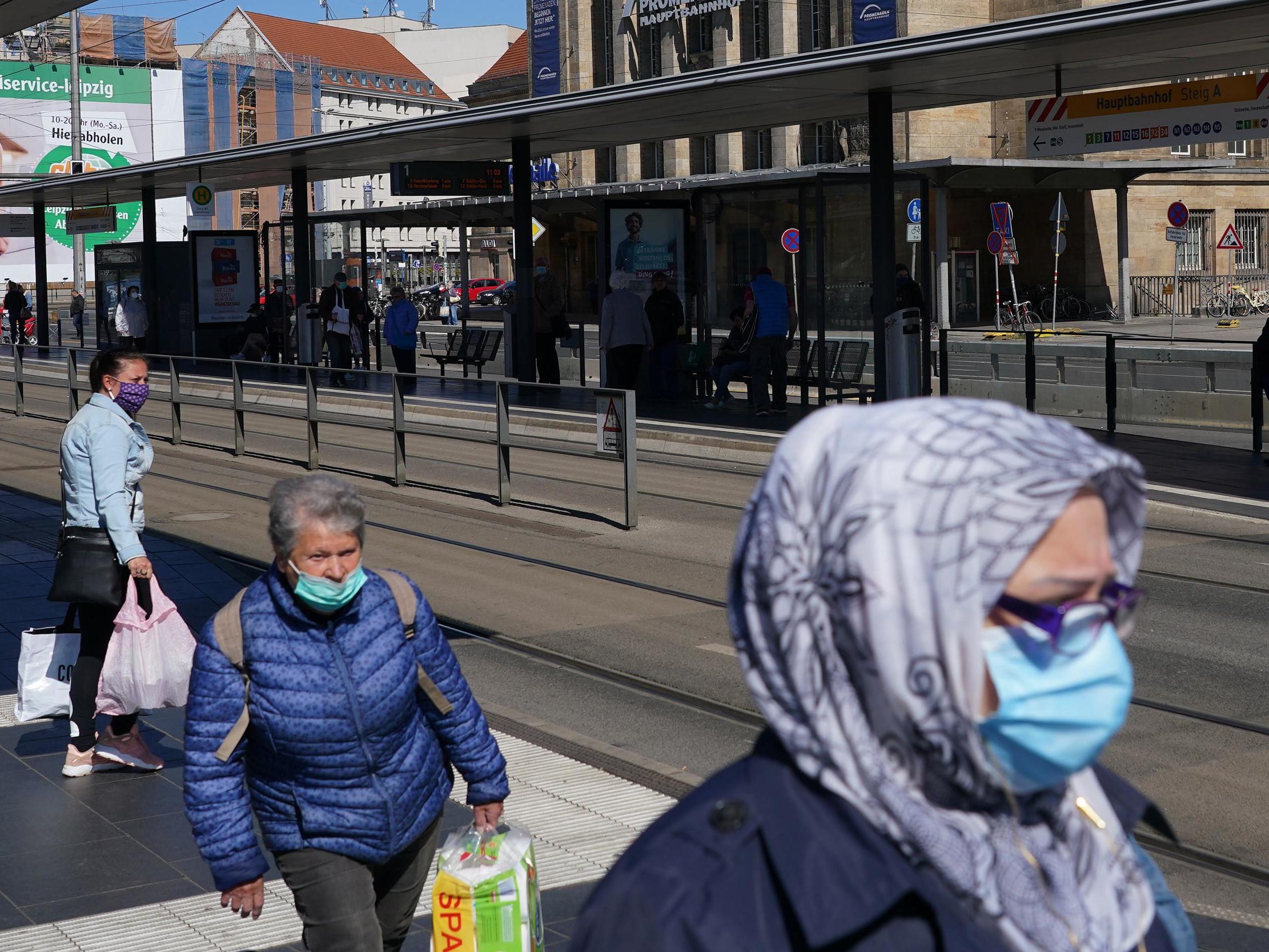 People in Leipzig venture outside with masks