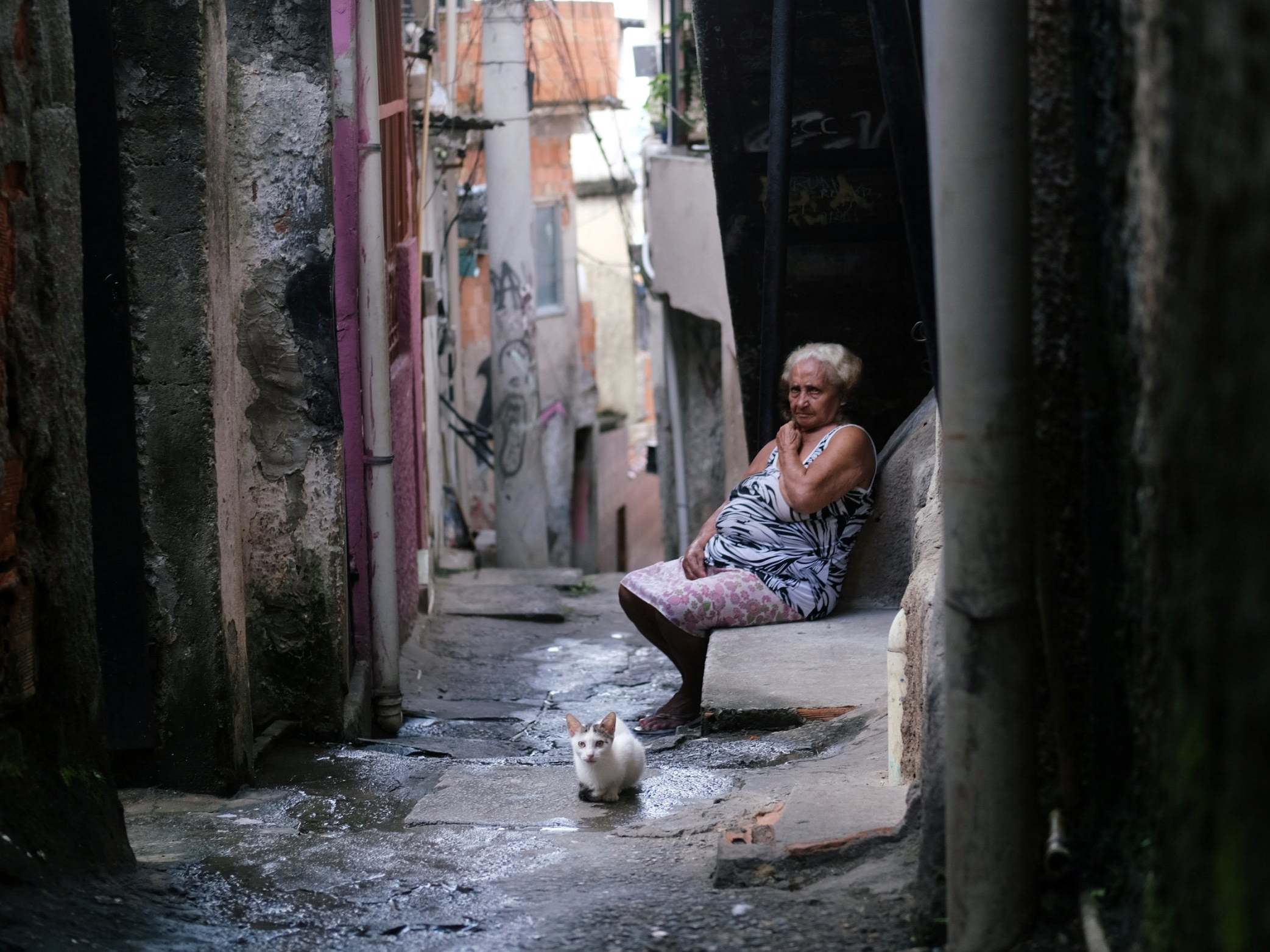 Maria das Neves, 76, cuts a lonely figure in Rio’s Alemao favela