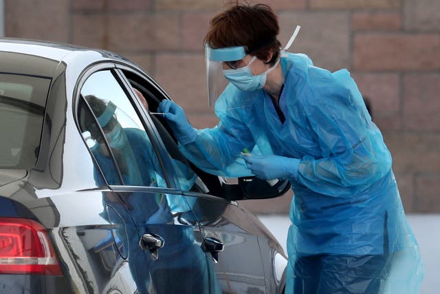A nurse takes a sample at a COVID 19 testing centre in the car park of the Bowhouse Community Centre in Grangemouth as the UK continues in lockdown to help curb the spread of the coronavirus