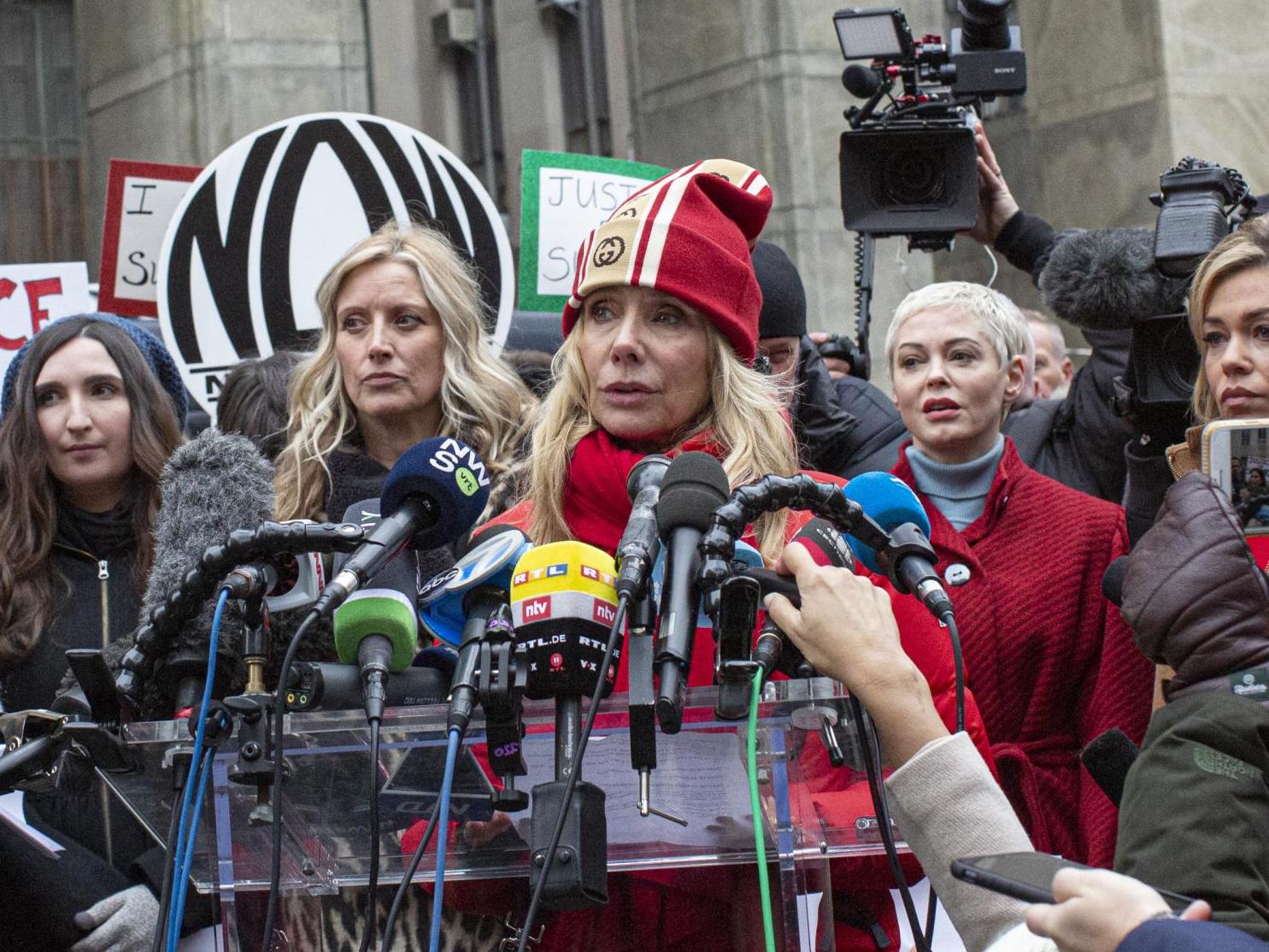 Weinstein accusers Rosanna Arquette and Rose McGowan (centre and left) speak to the media outside of Weinstein’s trial in January (Kena Betancur/Getty)