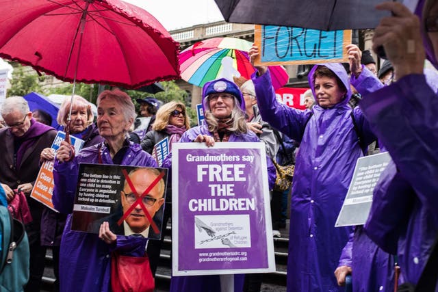 Protesters belonging to the ‘Grandmothers against detention’ group during a Palm Sunday rally demanding justice for refugees