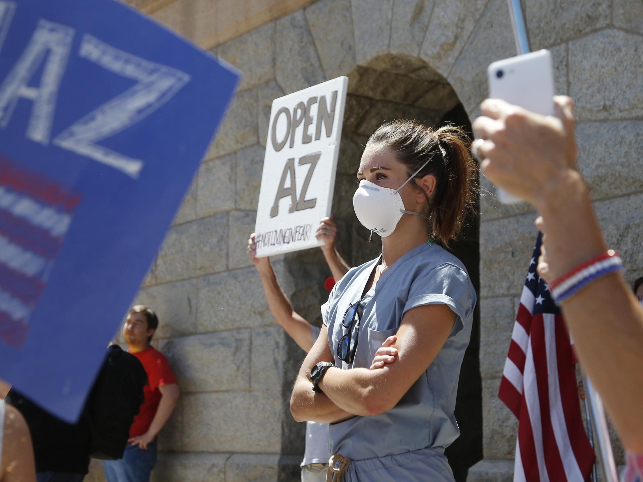 Masked nurses insulted and harassed as they stand up to anti-lockdown protesters in Arizona