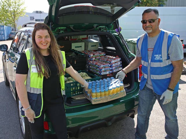 Jay Peshavaria, a volunteer from the Shree Jalaram Mandir and Community Centre Greenford, picks up food from th The Felix Project
