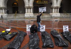 Protesters put body bags at Trump hotel to protest Covid-19 response
