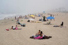 Thousands flock to California beaches as temperatures soar