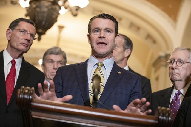 National Republican Senatorial Committee Chairman Todd Young, R-Ind., speaks to reporters after a Senate GOP luncheon.