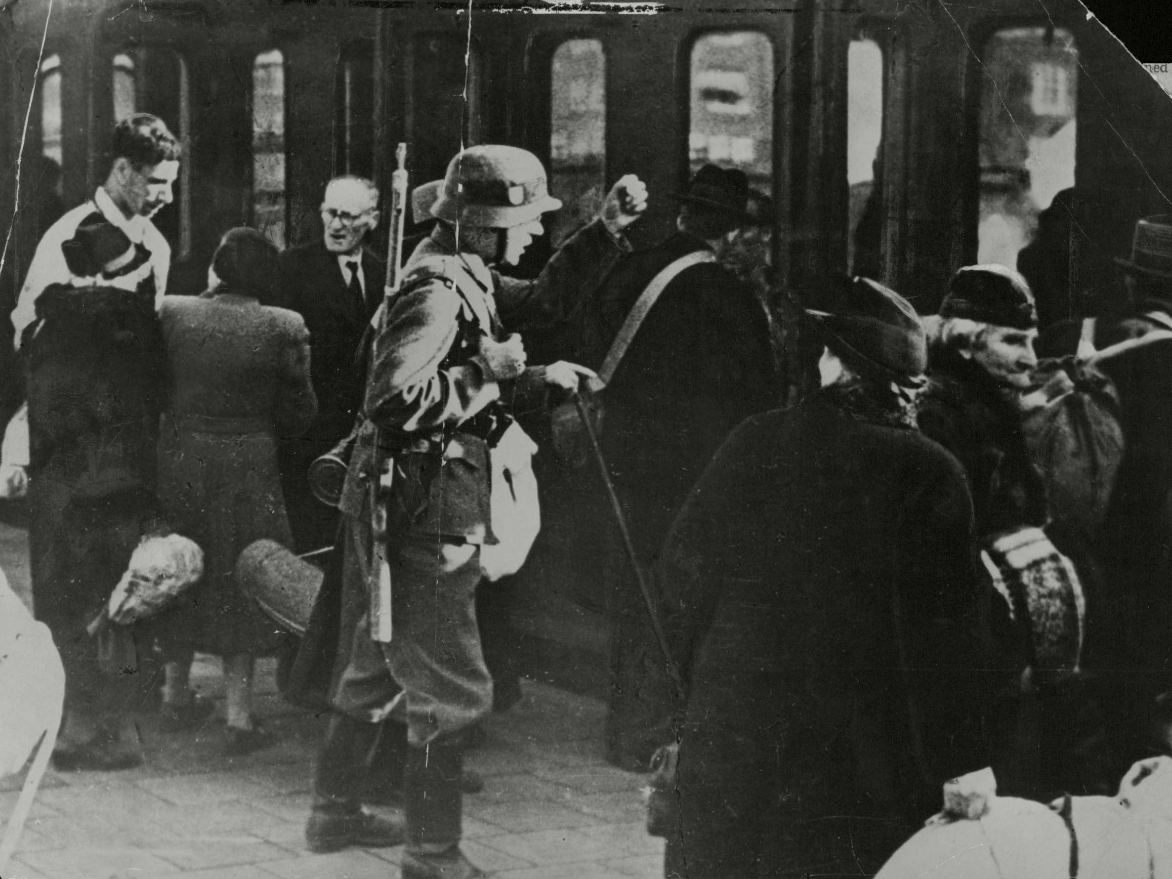 Jews are herded aboard a wartime train in Holland bound for concentration camps