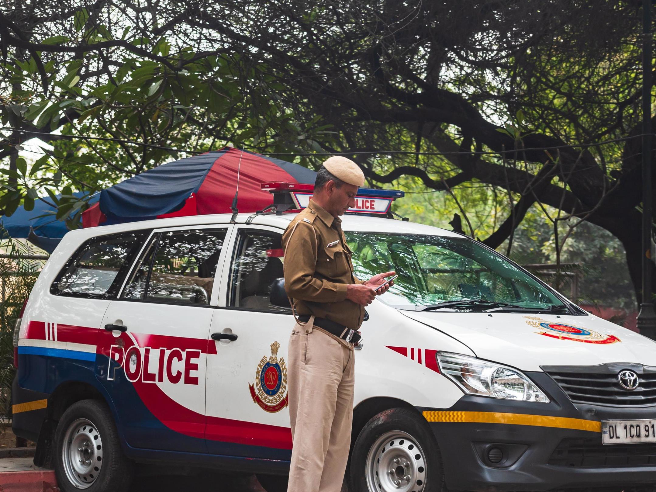 Police in India are enforcing the world's largest lockdown