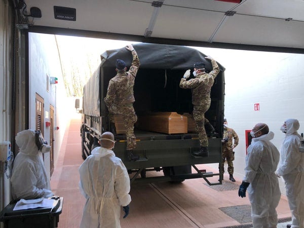 Coffins arrive in Florence from northern Italy for cremation