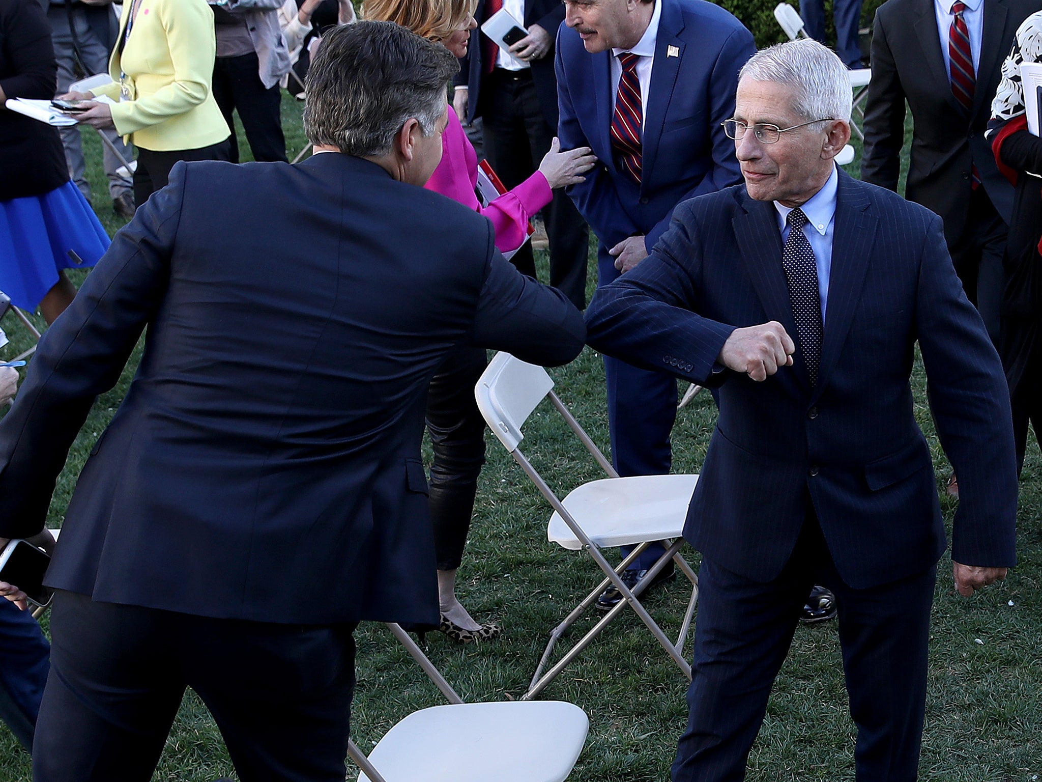 Dr Anthony Fauci, right, said you should never shake hands after the outbreak hit