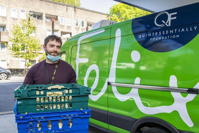 James Quayle, manager at North Paddington Food Bank, accepts a food delivery from the Felix Project