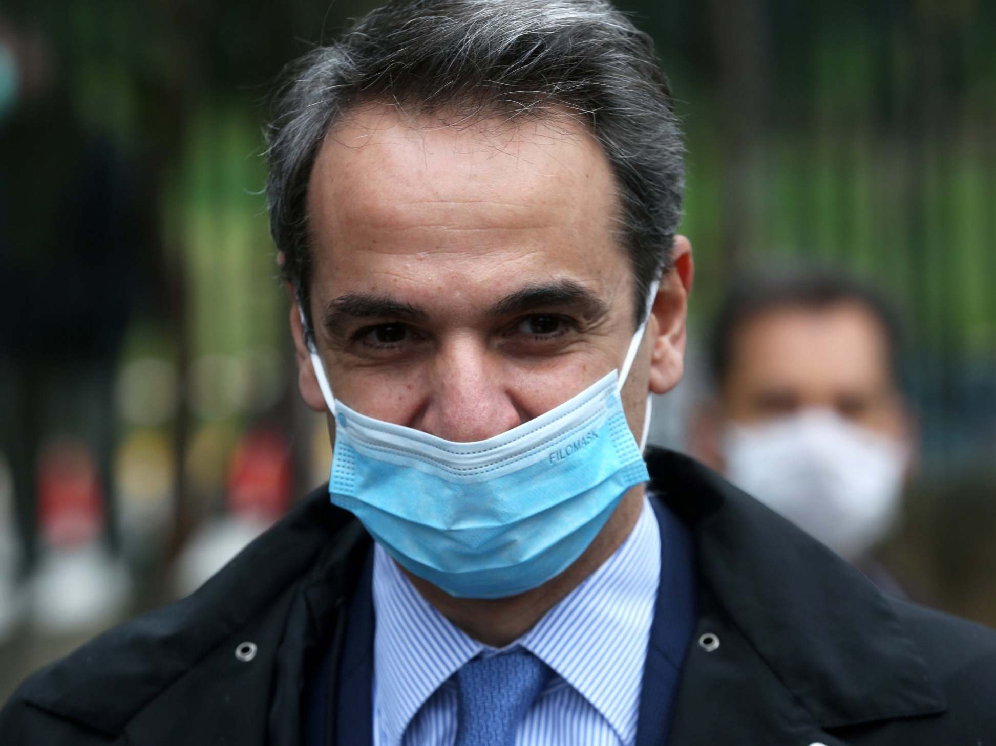 Green Prime Minister Kyriakos Mitsotakis wears a mask out in public