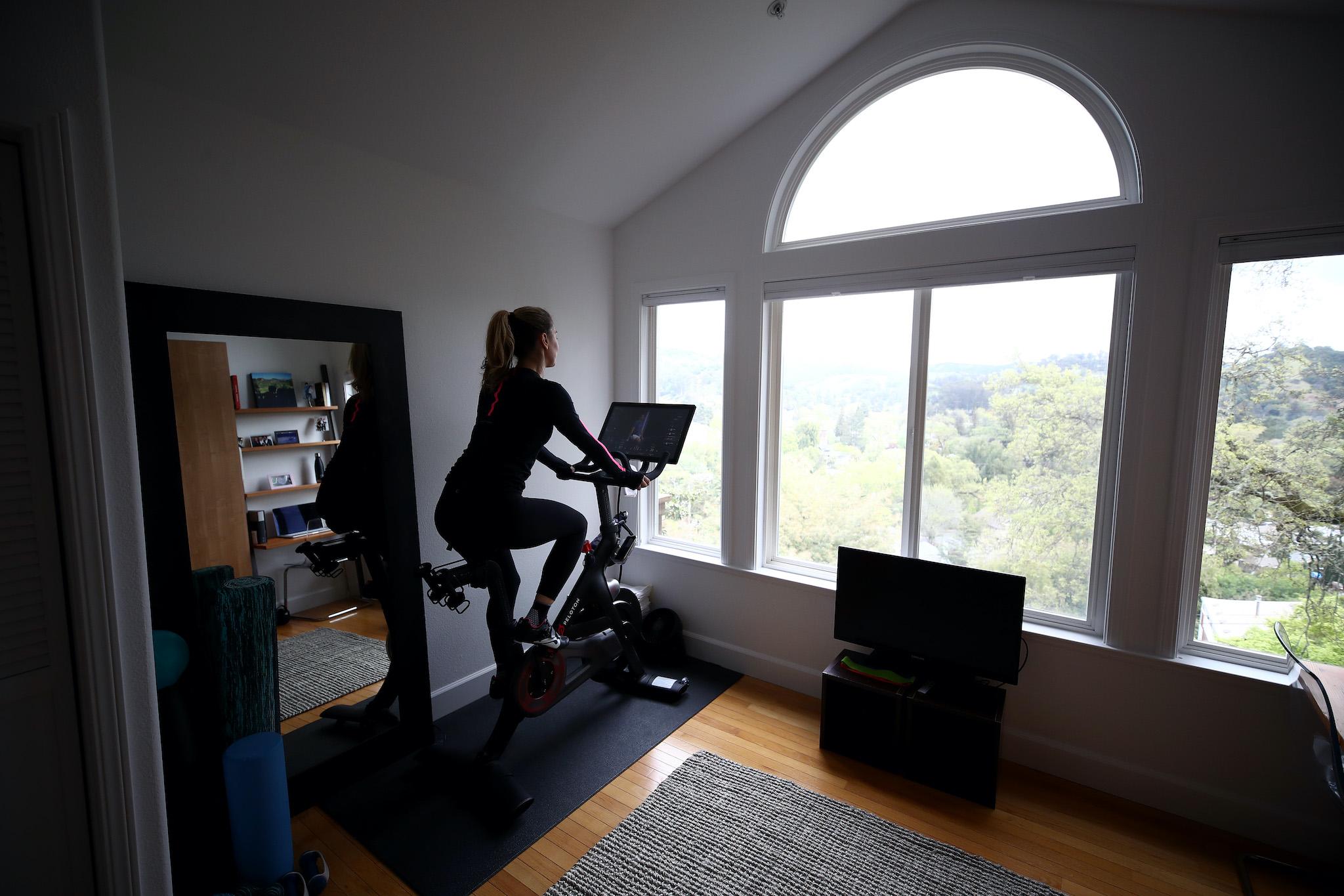 Peloton adds new 'groups' feature as people work out together from home, The Independent