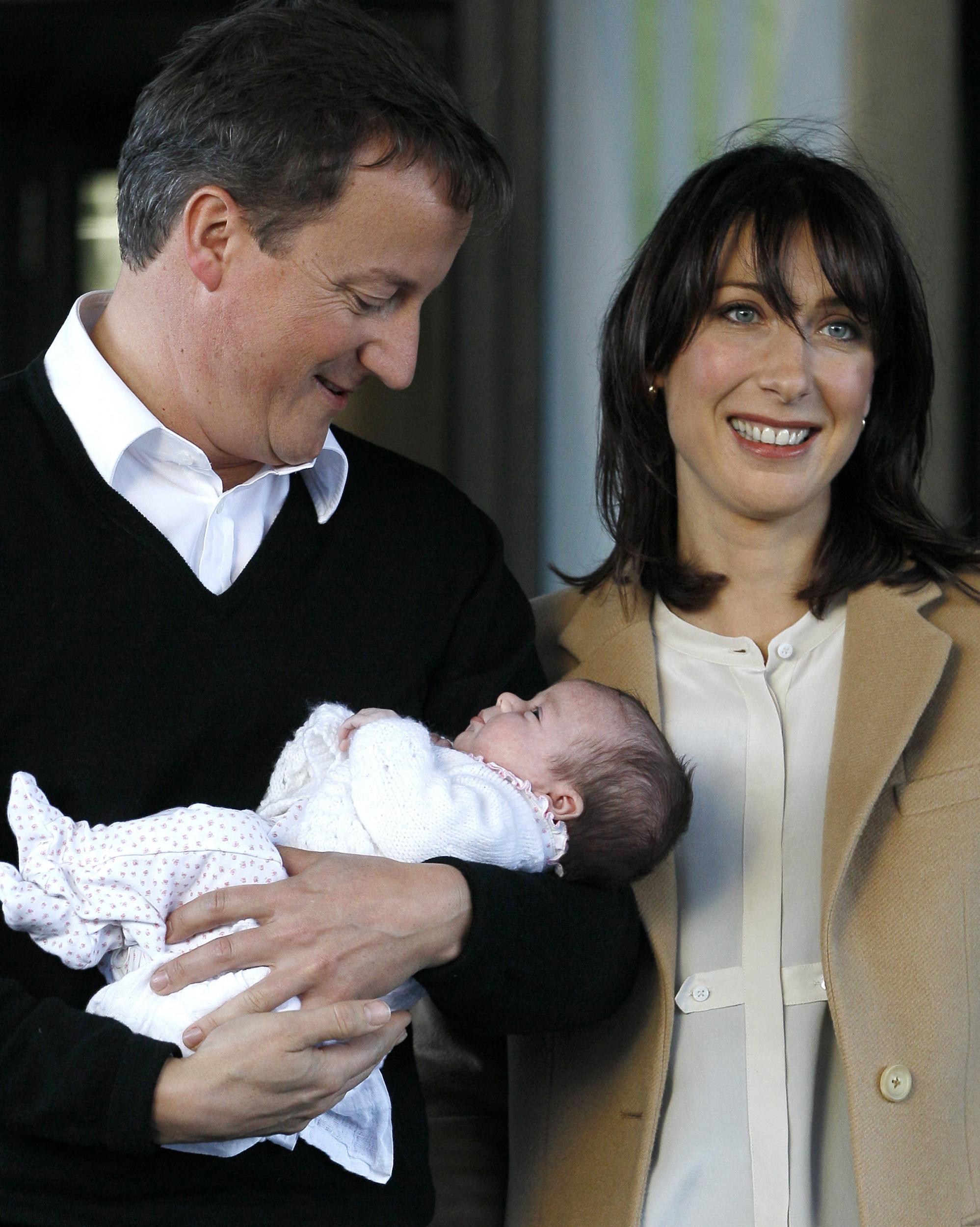 David Cameron arrives with his wife Samantha and their baby daughter Florence (5 October 2010)