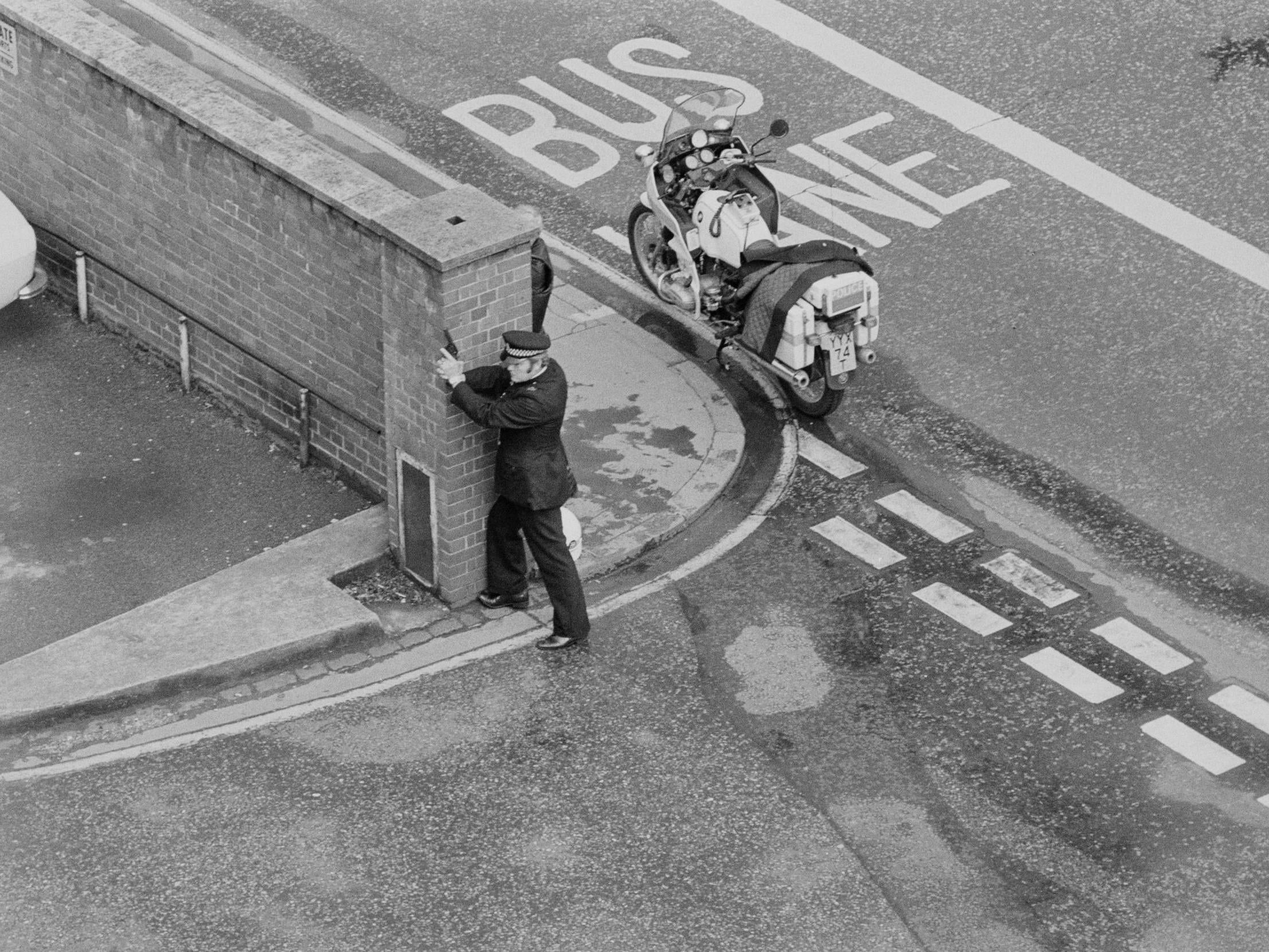 An armed policeman outside the Iranian Embassy, London, 30 April, 1980 (Getty)