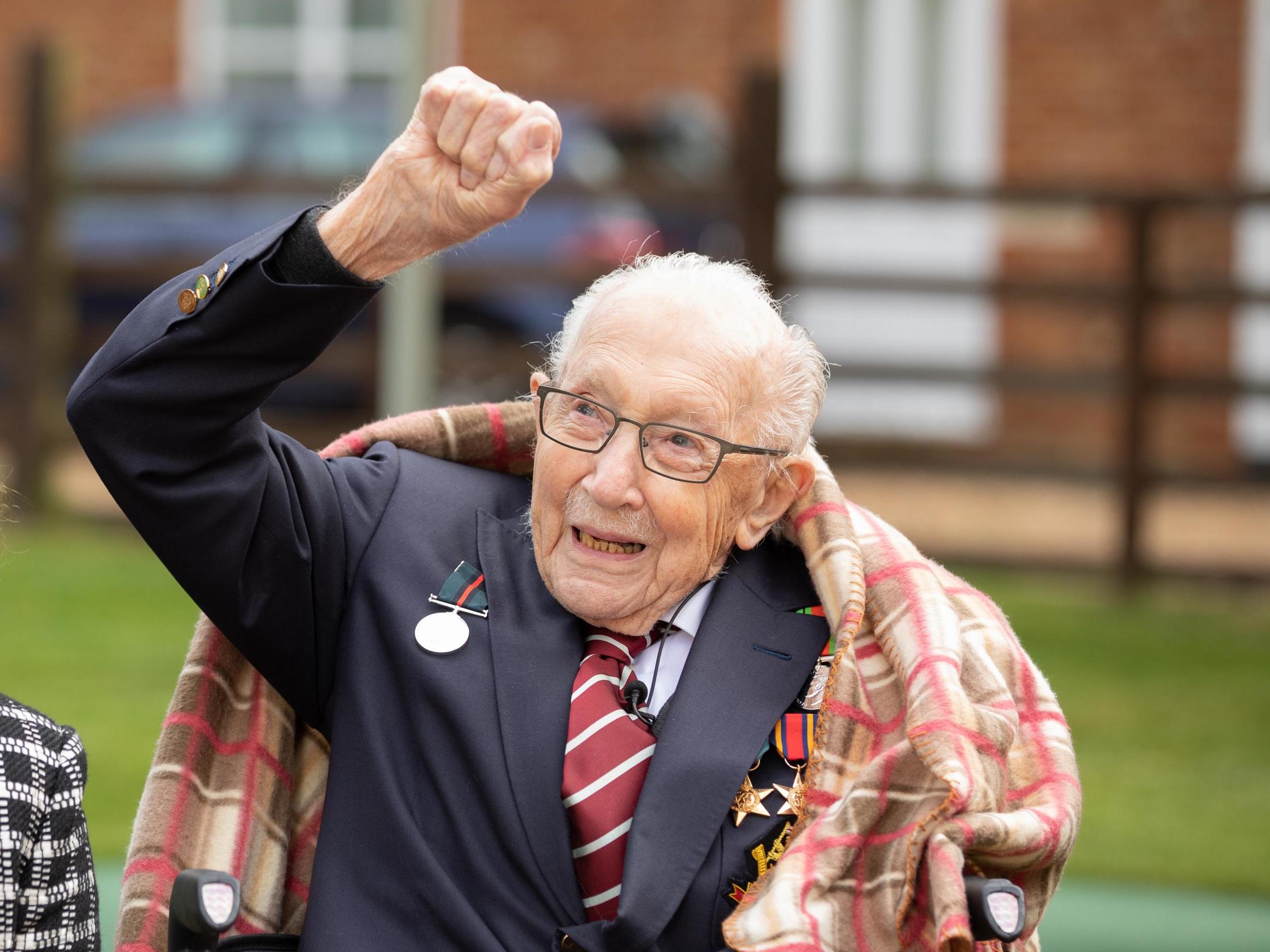 Captain Tom Moore watches RAF Spitfire and Hurricane flypast to mark 100th birthday